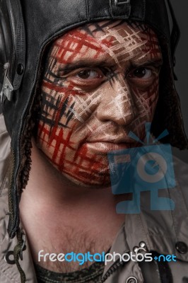 Creative And Funny Military Style Camouflage On Tankman Face Stock Photo