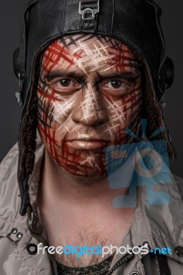 Creative And Funny Military Style Camouflage On Tankman Face Stock Photo