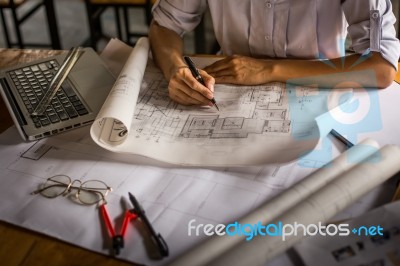 Creative Architect Projecting On The Big Drawings In The Dark Lo… Stock Photo