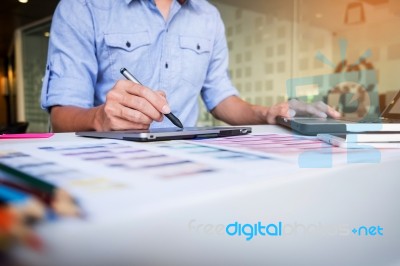 Creative Businessman Or Designer Writing On Graphic Tablet While… Stock Photo