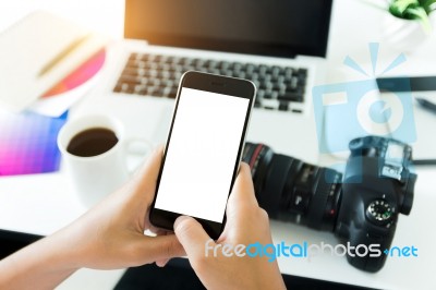 Creative Photogeapher Holding Phone White Screen On Workspace Ta… Stock Photo