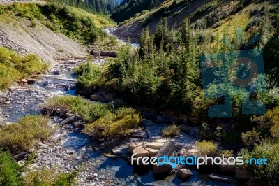 Creek In Glacier National Park Next To The Going To The Sun Road… Stock Photo