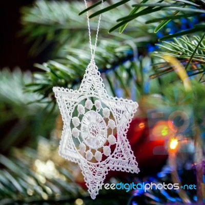 Crocheted Star On A Christmas Tree Stock Photo