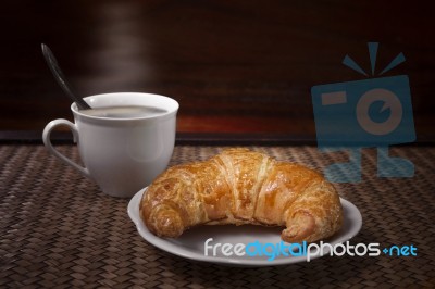 Croissant And Coffee Cup Stock Photo