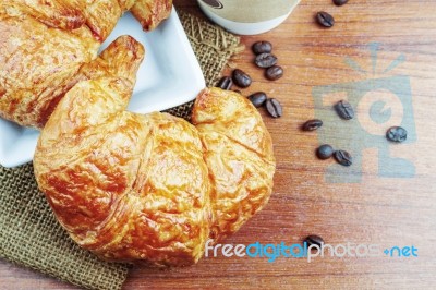 Croissants On Wooden Table Stock Photo