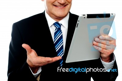 Cropped Image Of A Businessman Holding Tablet Pc Stock Photo