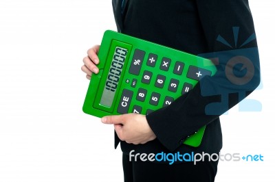 Cropped Image Of A Woman Holding Calculator Stock Photo