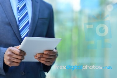 Cropped Image Of Businesman With Digital Tablet Stock Photo