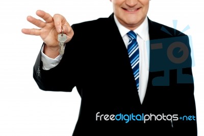 Cropped Image Of Businessman Holding Keys Stock Photo