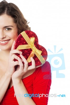 Cropped Image Of Smiling Woman Holding Present Stock Photo