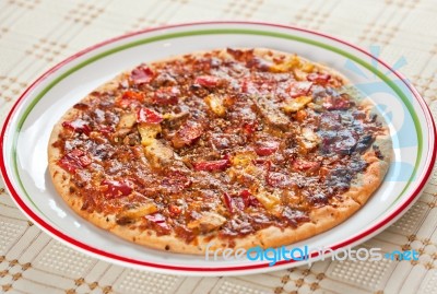 Crusty Cooked Pizza Stock Photo