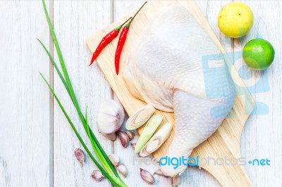 Culinary Background With Spices And Chicken Drumstick On Wooden Stock Photo