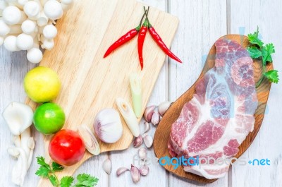 Culinary Background With Spices And Pork On Wooden Table Stock Photo