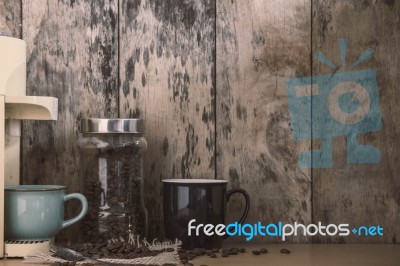 Cup And Beans On Wooden Stock Photo