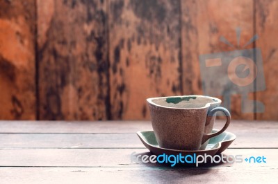 Cup And Saucer On Wooden Stock Photo