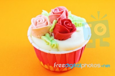 Cup Cake With Cream Rose Flower Stock Photo