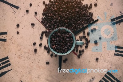 Cup Of Beans On Clock Stock Photo