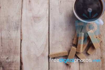 Cup Of Coffee And Wafers On The Wood Background Stock Photo