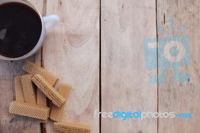 Cup Of Coffee And Wafers On The Wood Background Stock Photo