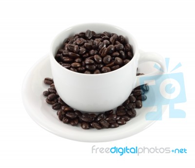 Cup Of Coffee Beans On White Background Stock Photo