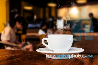 Cup Of Coffee On Table In Cafe Stock Photo