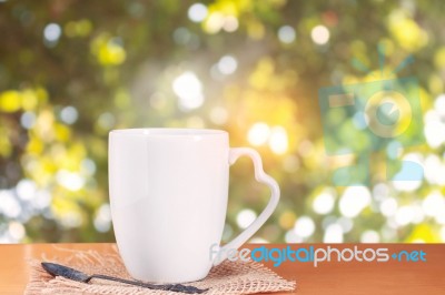 Cup Of Coffee On Wooden Stock Photo