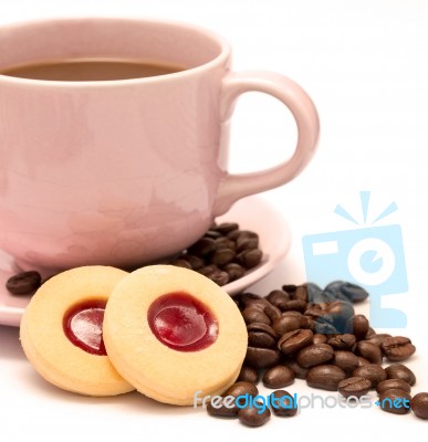 Cup Of Freshly Brewed Coffee And Some Strawberry Cookies Stock Photo