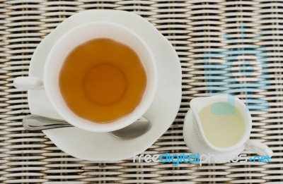 Cup Of Tea With Little Milk Jar Stock Photo