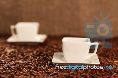 Cups With Coffee And Coffee Beans Stock Photo