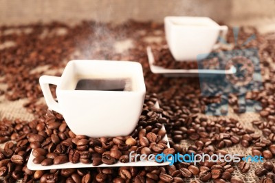 Cups With Coffee And Coffee Beans Stock Photo