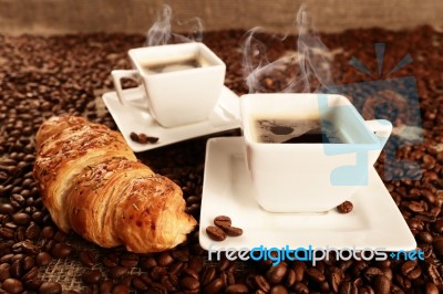 Cups With Coffee And Coffee Beans Stock Photo