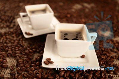 Cups With Coffee And Coffee Beans Stock Photo