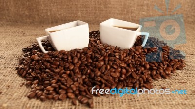 Cups With Coffee And Coffee Beans Stock Photo