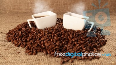 Cups With Coffee And Coffee Beans Stock Photo