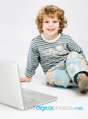 Curl Hair Boy Near Laptop Stock Photo