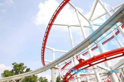 Curve Of Red And White Roller Coaster Rail Stock Photo