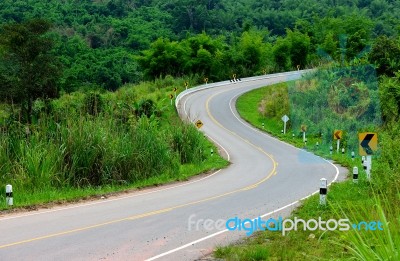 Curve Road With Sign Post Stock Photo