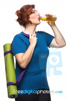 Curvy Woman Carrying Yoga Mat Stock Photo