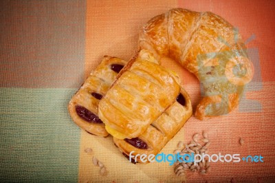 Custard Cake And Croissant Bread On Natural Clothes Stock Photo