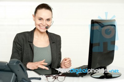 Customer Care Executive Using Tablet Pc Stock Photo