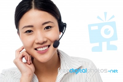 Cute Asian Female As Help Desk Operator Stock Photo