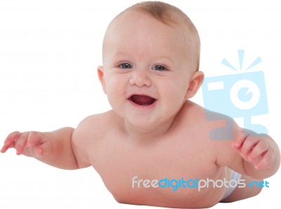 Cute Baby Boy Smiling While Lying On His Tummy Stock Photo