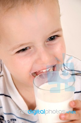 Cute Child Drinking Milk Stock Photo