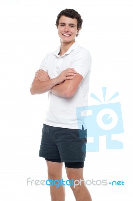 Cute Guy Posing With Crossed Arms Stock Photo