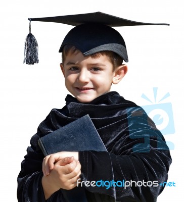 Cute Kid Graduate With Graduation Cap Stock Photo