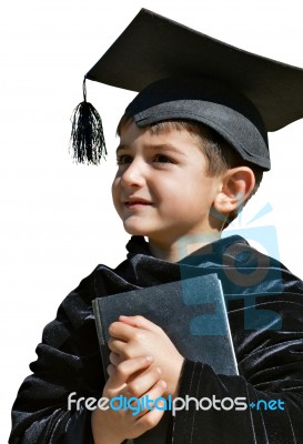 Cute Kid Graduate With Graduation Cap Stock Photo