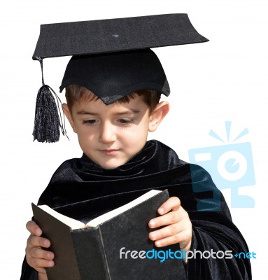 Cute Kid Graduate With Graduation Cap Stock Photo