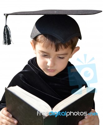 Cute Kid Graduate With Graduation Cap Stock Photo