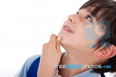 Cute Kid Thinking And Looking Up Stock Photo