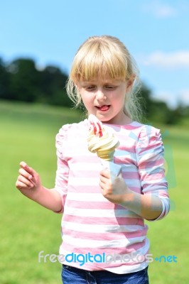 Cute Little Girl Eating Ice Cream Stock Photo